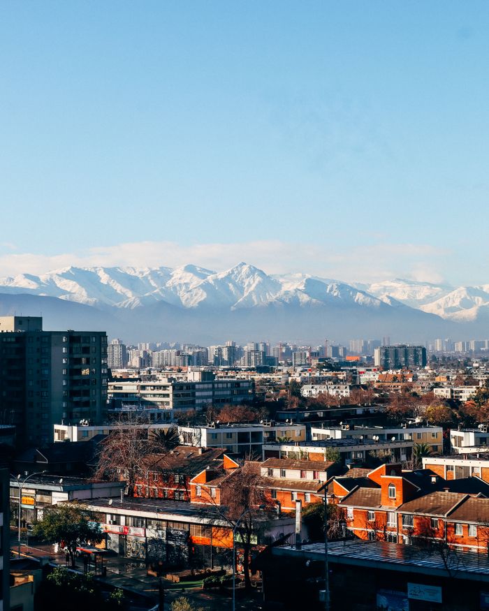 Santiago city skyline with Andes mountains in the background, vibrant city view.